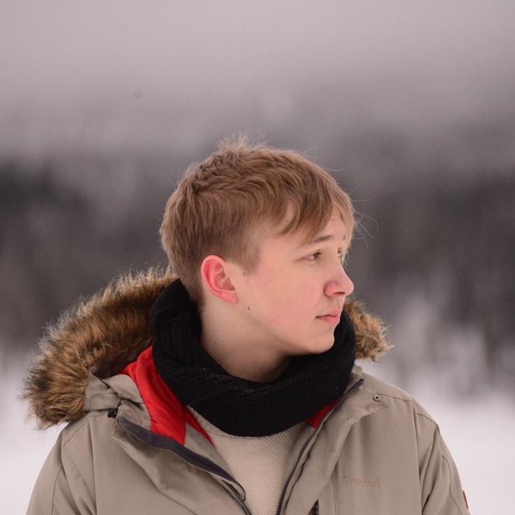 Avery Chen, Lead Design Curator at EnginePressWorks, reviewing corporate floral arrangements